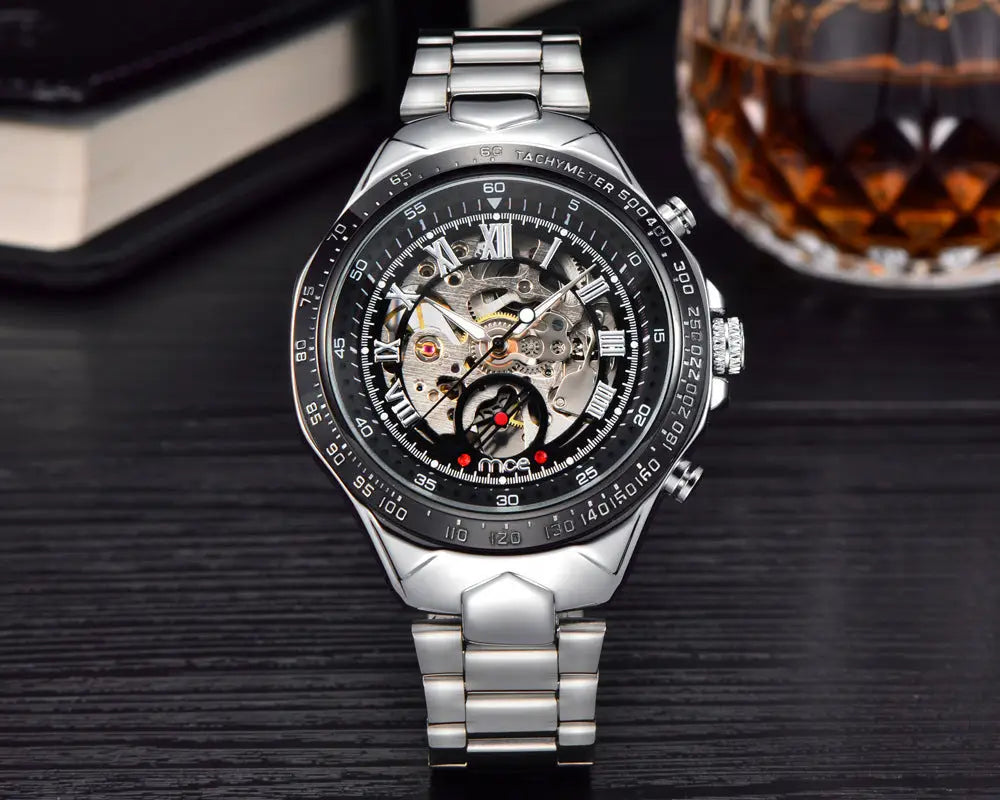 R&Z mens mechanical watch silver-toned skeletonized chronograph with black dial roman numerals and exposed gears
