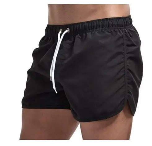 Black athletic shorts with white drawstrings and stretchy elastic waistband in featured shorts premium casual and active styles
