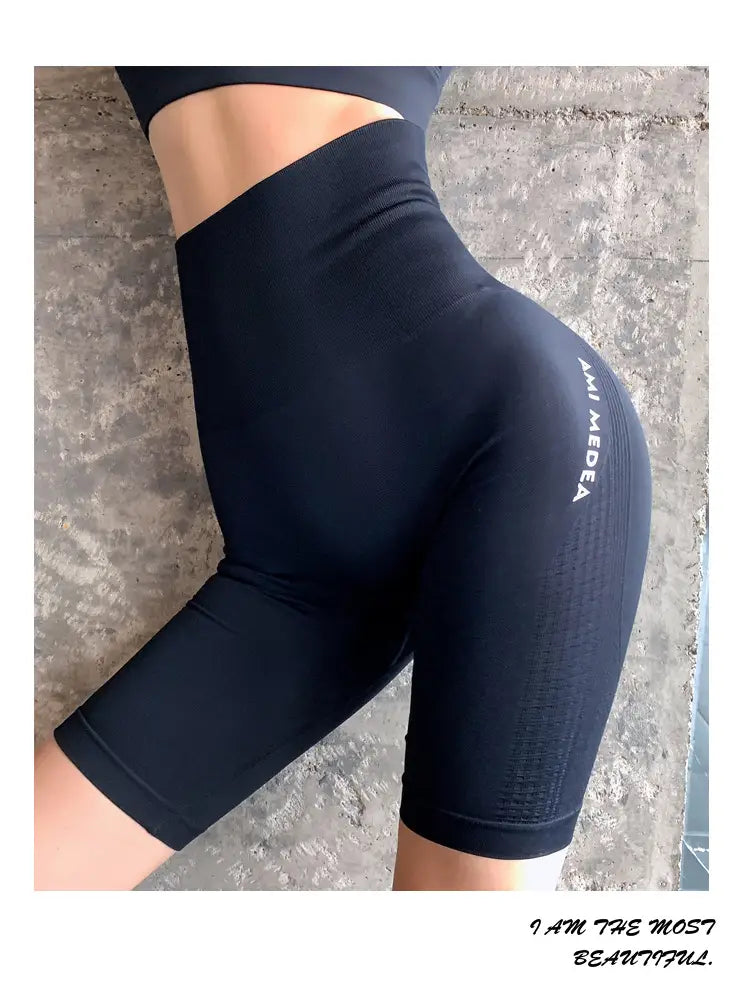 Black women's high-waist biker shorts with a wide waistband and textured side panels