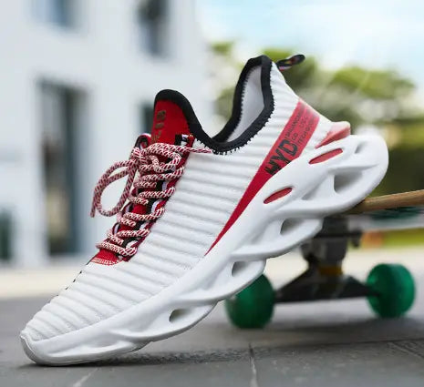 White knit running shoe with red accents, patterned laces and a sculpted white sole