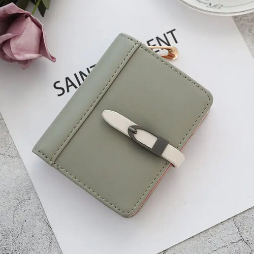 Classic Morandi folding card wallet in sleek sage green with white belt buckle closure and subtle stitching details