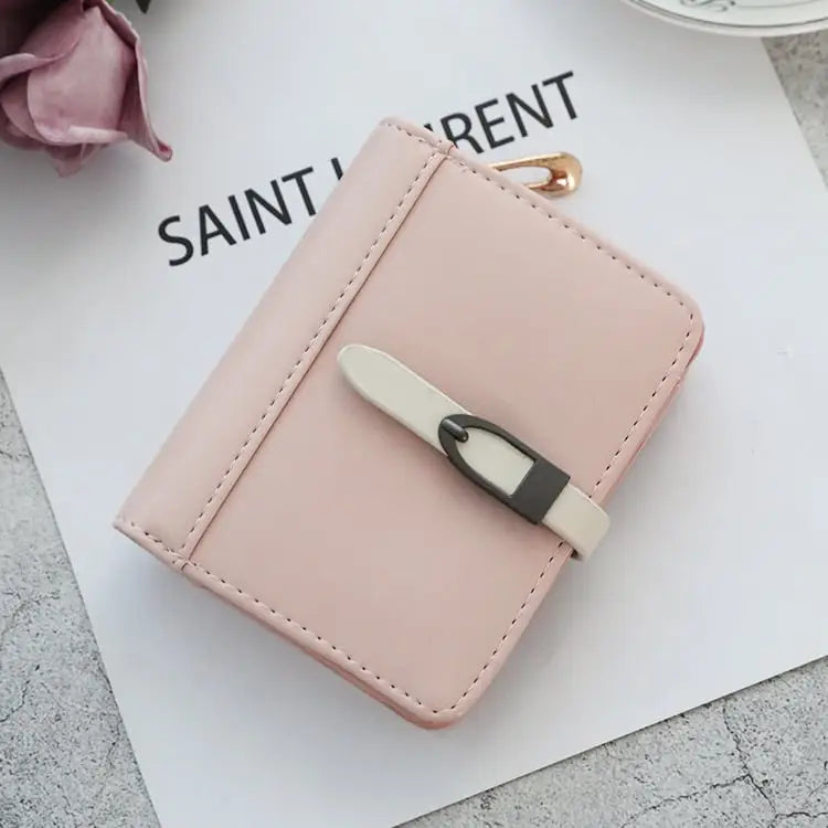 Classic Morandi folding card wallet in delicate pink faux leather with cream and dark gray buckle closure