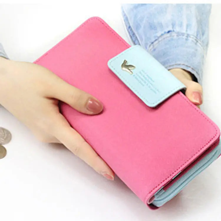 Pink coin purse wallet with light blue flap and gold-tone horse emblem designer wallet image