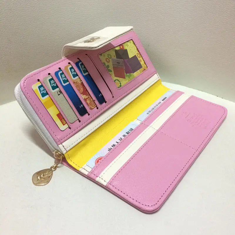Pink and white zippered coin purse wallet with gold leaf charm card slots and id window designer wallet image