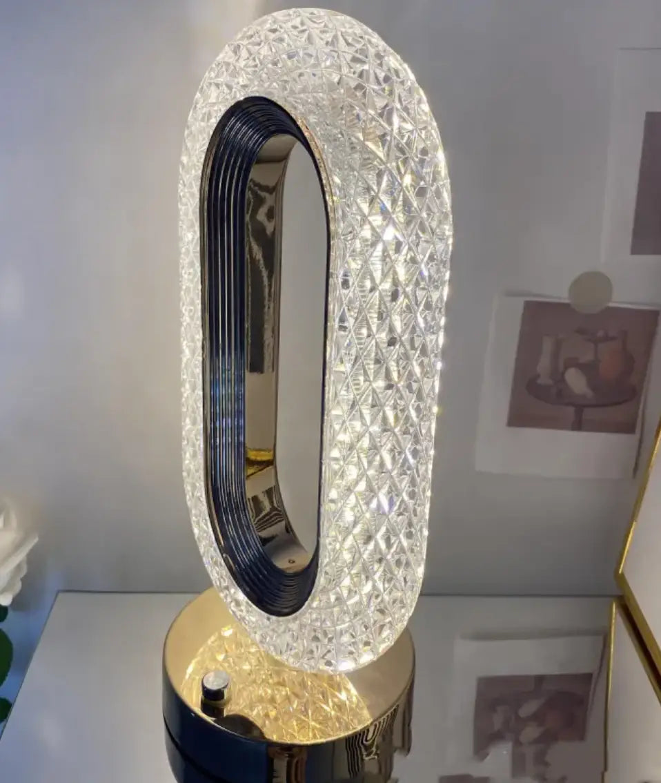 Crystal touch desk lamp with a faceted crystal exterior and gold-toned base for light luxury home decor