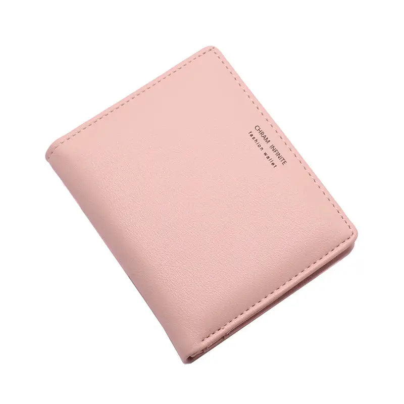 A soft pink korean letters slim wallet with subtle stitching and a small embossed brand name minimalist design