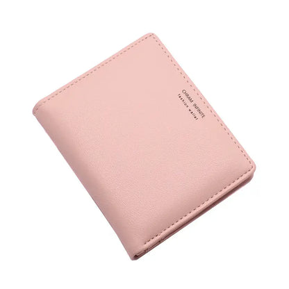 A soft pink korean letters slim wallet with subtle stitching and a small embossed brand name minimalist design
