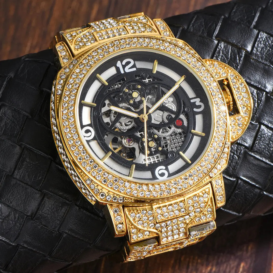 Men’s diamond luminous hollow mechanical watch in gold tone with black dial white numerals and textured black leather strap