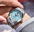 R&Z luminous mens mechanical watch with a silver stainless steel bracelet and light blue textured dial packing box included