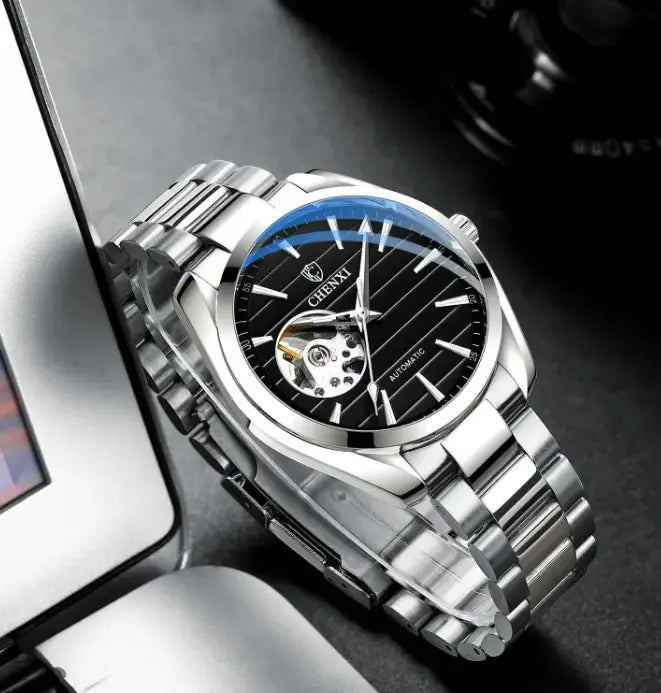 R&Z men’s silver-toned automatic hollow mechanical watch with black dial blue bezel and exposed movement