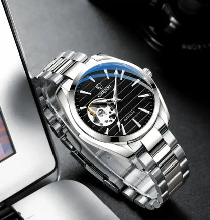 R&amp;Z men’s silver-toned automatic hollow mechanical watch with black dial blue bezel and exposed movement