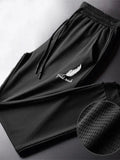 Black mesh outdoor wolf pants with white feather and gold rush embroidery on the thigh by R&z