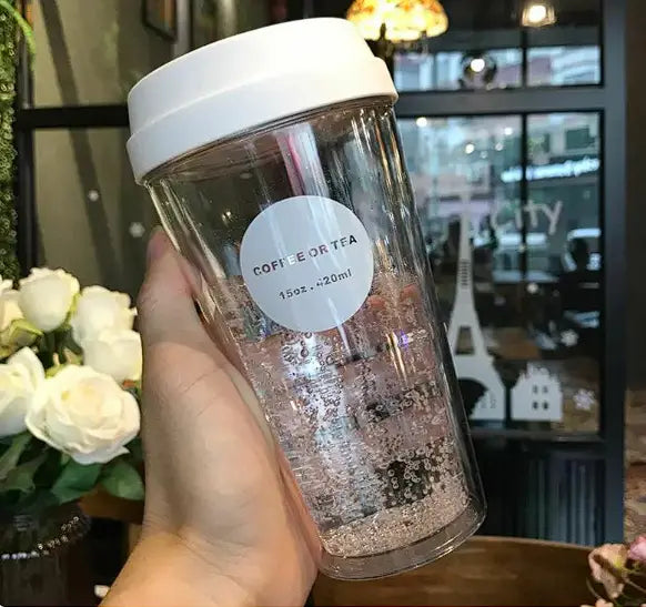 Clear double coffee cup with a white lid and a circular coffee or tea label 15oz from r&z portable double coffee cup
