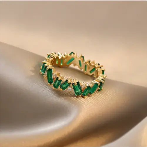 Detailed View of Women's Luxe Zirconia Ring in Gold and Green